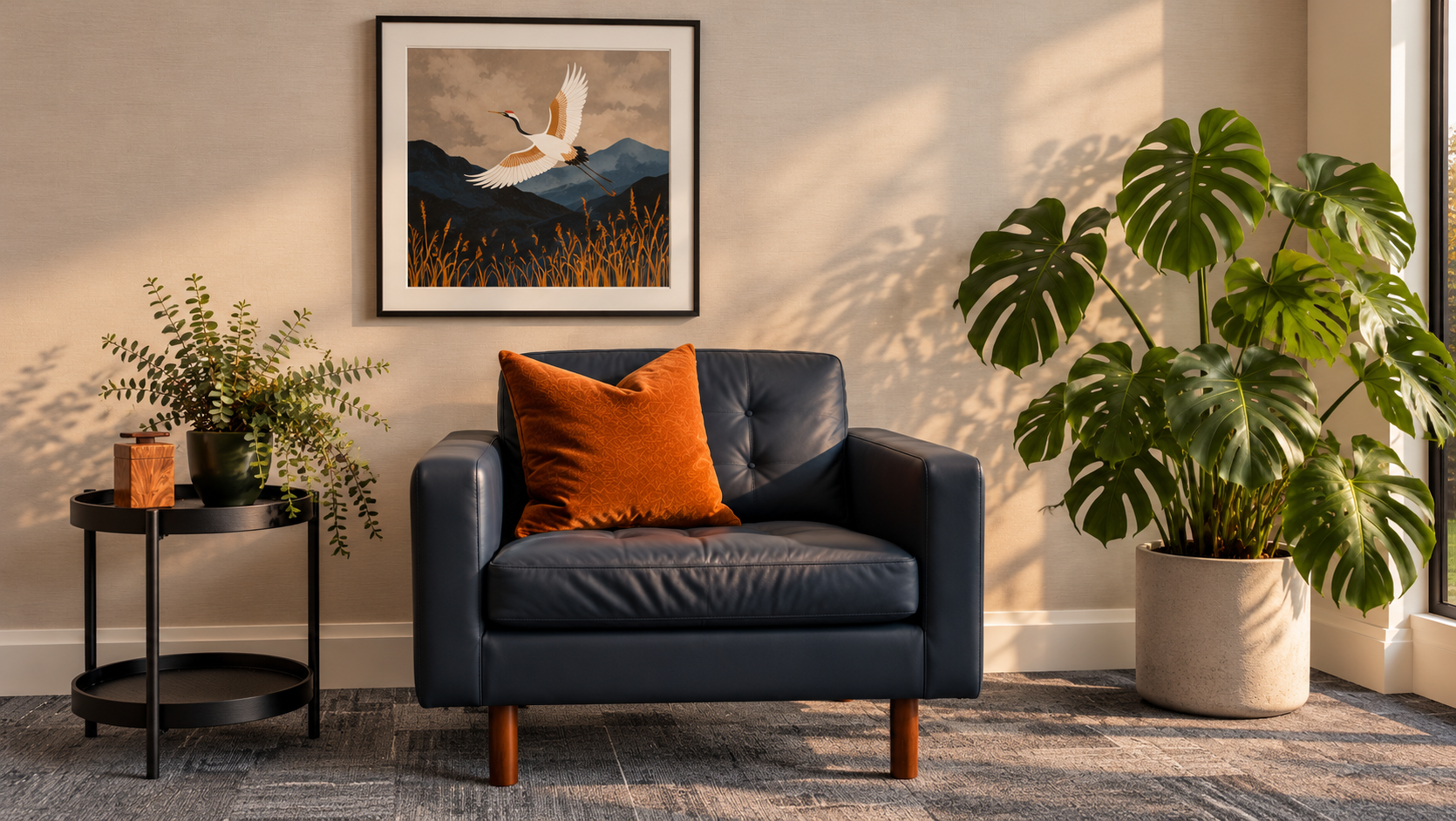 Blue armchair with an orange cushion, framed artwork, and plants in a welcoming psychology office.